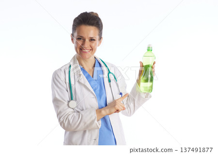 Female Physician Pointing to Healthy Nutritional Drink 137491877