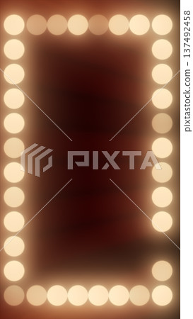 Vintage glowing light bulb frame on a warm background, resembling a theater or makeup mirror with empty copy space 137492458