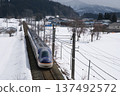 E8 Series Shinkansen running through a snowy landscape E8 Series Shinkansen running through a snowy landscape 137492572
