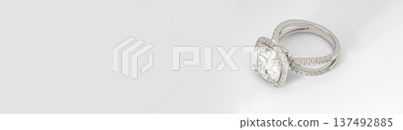 Banner with copy space. A large diamond ring with a white band Banner with copy space. A large diamond ring with a white band 137492885
