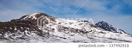 Banner with copy space. A mountain covered in snow and a clear blue sky Banner with copy space. A mountain covered in snow and a clear blue sky 137492918