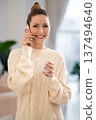 Young woman talking on the phone and smiling nicely 137494640