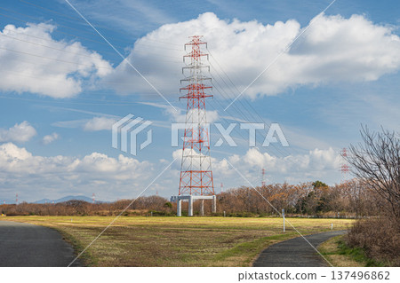 Power line tower standing on the riverbed of Takatsuki City, right bank of the Yodo River, Osaka Prefecture 137496862