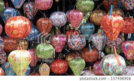 Colorful lanterns glowing at night in Hoi An, Vietnam traditional lantern festival street lights Colorful lanterns glowing at night in Hoi An, Vietnam traditional lantern festival street lights 137496908