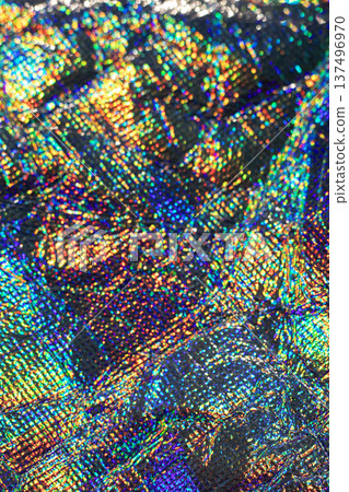 Vibrant iridescent holographic texture with rainbow color, abstract shimmer and kaleidoscopic pattern 137496970