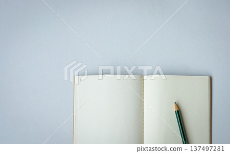 Open notepad with one pencil. Open notepad with one pencil. 137497281