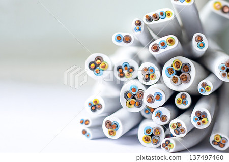 Close up of colorful electrical cables with exposed ends and bright insulated wires Close up of colorful electrical cables with exposed ends and bright insulated wires 137497460