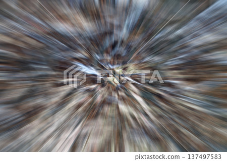 Abstract radial burst of color with dynamic motion and light in a zoomed center 137497583