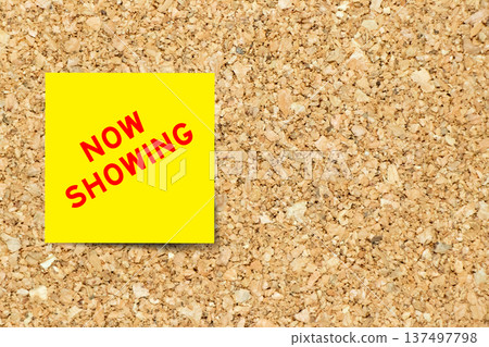 Yellow note paper with word now showing on cork board background with copy space Yellow note paper with word now showing on cork board background with copy space 137497798