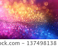 Vibrant bokeh lights and glitter gradient in pink, orange, yellow, and blue 137498138
