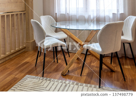 dining area with round glass table dining area with round glass table 137498779