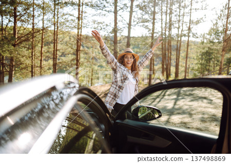 Young woman enjoying and having fun in their vacations outdoors leaning out car window. Summer trip. Young woman enjoying and having fun in their vacations outdoors leaning out car window. Summer trip. 137498869