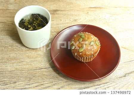 butter banana cake topping peanut and whole grain on plate with hot Chinese tea cup 137498972