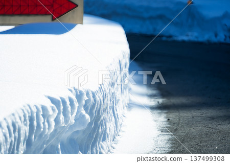 Winter road scenery unique to snowy regions and clean road surfaces after snow removal work Winter road scenery unique to snowy regions and clean road surfaces after snow removal work 137499308