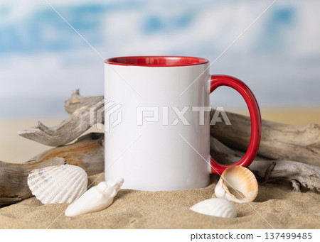 Accent mug mockup, ceramic 11oz mug with red handle on sand with seashells and driftwood 137499485