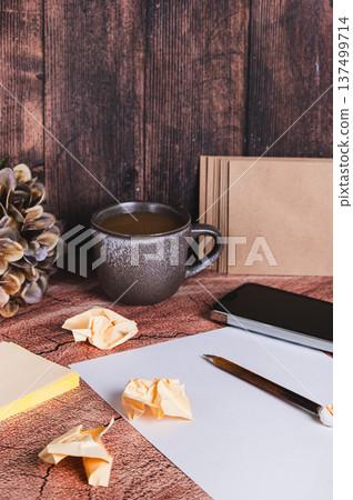 Concept of writing a resume for a job application, paper and pen on the table vertical view 137499714