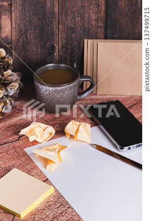 A professional workstation for writing a resume, paper, pen, and smartphone vertical view A professional workstation for writing a resume, paper, pen, and smartphone vertical view 137499715