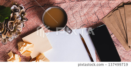 A professional workstation for writing a resume, paper, pen, and smartphone top view web banner A professional workstation for writing a resume, paper, pen, and smartphone top view web banner 137499719