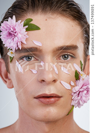 Natural, skincare and flowers with portrait of man in studio for spring, beauty cosmetics and creative. Glow, non binary and floral with face of model on white background for makeup, spa and wellness Natural, skincare and flowers with portrait of man in studio for spring, beauty cosmetics and creative. Glow, non binary and floral with face of model on white background for makeup, spa and wellness 137499891