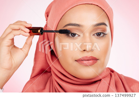 Mascara brush, portrait or Islamic woman with studio cosmetic tools, skincare or grooming facial lashes. Eyelash product application, spa salon or hijab face of Arabic Muslim model on pink background Mascara brush, portrait or Islamic woman with studio cosmetic tools, skincare or grooming facial lashes. Eyelash product application, spa salon or hijab face of Arabic Muslim model on pink background 137499927