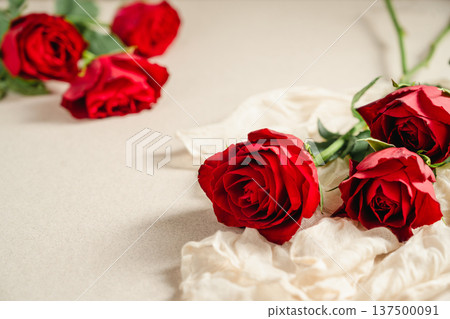 Mother's Day or Valentine's Day background. Red rose flowers on neutral background. Greeting card template, copy space Mother's Day or Valentine's Day background. Red rose flowers on neutral background. Greeting card template, copy space 137500091