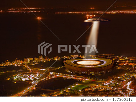 UFO, light and city in night, alien invasion and search with light on stadium in Cape Town. UAP ship, flying saucer and tractor beam in dark cityscape, metro or cbd for survey, inspection and flight 137500112
