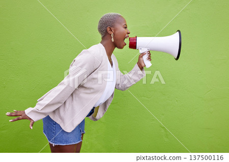 Black woman, megaphone and protest on mockup space in advertising or voice against a studio background. African female person screaming in bullhorn or shouting for sale discount, vote or alert Black woman, megaphone and protest on mockup space in advertising or voice against a studio background. African female person screaming in bullhorn or shouting for sale discount, vote or alert 137500116