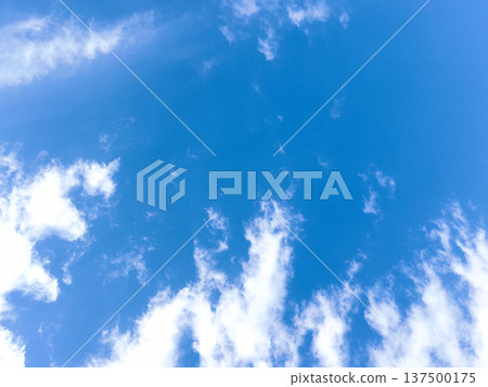 Clouds rising in the blue sky Clouds rising in the blue sky 137500175