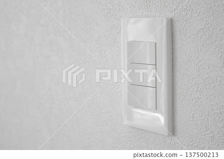 Close-up of a white wall and switch Close-up of a white wall and switch 137500213