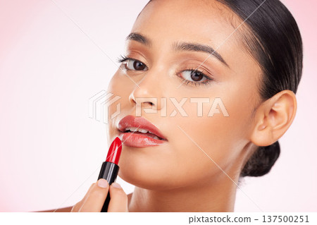 Beauty, makeup and red lipstick with portrait of woman in studio for cosmetics, glamour and product. Glow, self care and spa with face of person on pink background for salon, cosmetology and lip balm Beauty, makeup and red lipstick with portrait of woman in studio for cosmetics, glamour and product. Glow, self care and spa with face of person on pink background for salon, cosmetology and lip balm 137500251