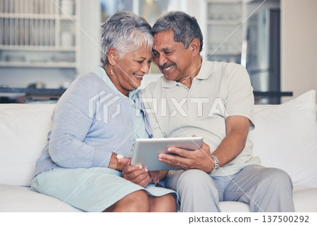 Happy, tablet and senior couple streaming movie or show with love, care and bonding in home living room together. Couch, app and elderly people relax and watching a subscription service on retirement Happy, tablet and senior couple streaming movie or show with love, care and bonding in home living room together. Couch, app and elderly people relax and watching a subscription service on retirement 137500292