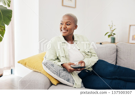 Woman, happy and thinking with phone on sofa to relax with social media, digital contact and user connection. African person, smartphone and idea for mobile blog, search subscription and app at home Woman, happy and thinking with phone on sofa to relax with social media, digital contact and user connection. African person, smartphone and idea for mobile blog, search subscription and app at home 137500307