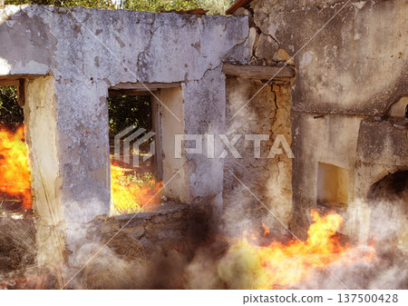 Disaster, damage and fire with house and smoke from danger, chaos accident and devastation. War, crisis and abandoned with broken building structure for grunge, construction and military attack Disaster, damage and fire with house and smoke from danger, chaos accident and devastation. War, crisis and abandoned with broken building structure for grunge, construction and military attack 137500428
