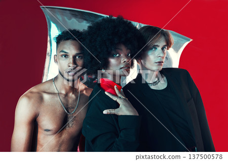 Queer, diversity and portrait of people in fashion with creative black woman, gay man and model on red background in studio. Lgbt, friends and beauty for edgy, aesthetic or unique makeup and clothes Queer, diversity and portrait of people in fashion with creative black woman, gay man and model on red background in studio. Lgbt, friends and beauty for edgy, aesthetic or unique makeup and clothes 137500578