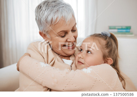 Love, couch, and child hug grandmother in a home for bonding, care and relax together for travel or road trip. Senior, sofa and elderly person or grandparent with girl kid as family on retirement Love, couch, and child hug grandmother in a home for bonding, care and relax together for travel or road trip. Senior, sofa and elderly person or grandparent with girl kid as family on retirement 137500586