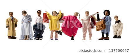 Kids posing with shopping bags and oversized clothes, symbolizing playful consumer culture and childhood imagination. Kids posing with shopping bags and oversized clothes, symbolizing playful consumer culture and childhood imagination. 137500627