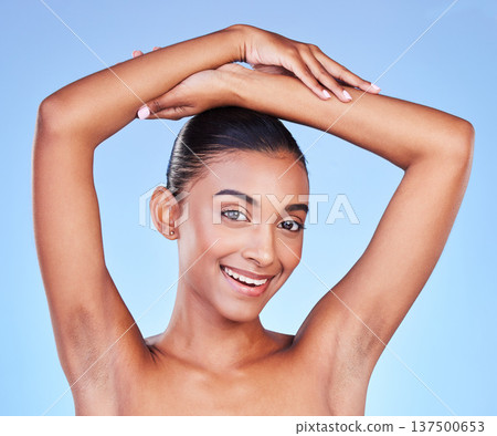 Armpit, hair removal and woman in portrait with beauty, grooming and smile isolated on blue background. Hygiene, cleaning body and epilation with skincare, cosmetics and dermatology in a studio Armpit, hair removal and woman in portrait with beauty, grooming and smile isolated on blue background. Hygiene, cleaning body and epilation with skincare, cosmetics and dermatology in a studio 137500653