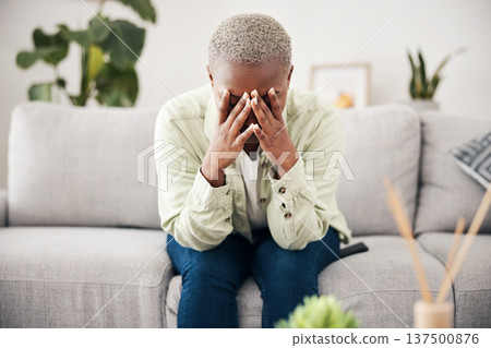 Woman, depression and crying on sofa for anxiety, mental health and stress of bad mistake at home. Doubt, sad and frustrated african person scared of trauma, headache and counselling of broken heart Woman, depression and crying on sofa for anxiety, mental health and stress of bad mistake at home. Doubt, sad and frustrated african person scared of trauma, headache and counselling of broken heart 137500876