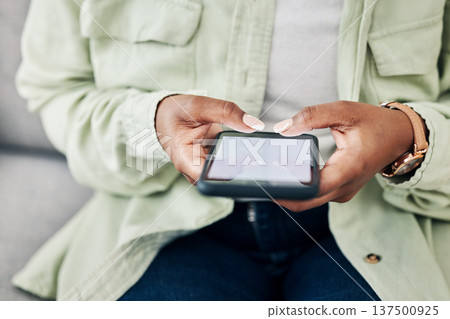 Phone, screen or hands of woman online for email communication, chat texting or social media. Reading news, closeup or person typing on app to scroll website or digital network on couch at home Phone, screen or hands of woman online for email communication, chat texting or social media. Reading news, closeup or person typing on app to scroll website or digital network on couch at home 137500925