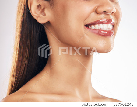 Woman, face and teeth whitening with smile, dental and health, skin and lip gloss on white background. Mouth wellness, oral healthcare and orthodontics, veneers and makeup, cosmetic care in studio Woman, face and teeth whitening with smile, dental and health, skin and lip gloss on white background. Mouth wellness, oral healthcare and orthodontics, veneers and makeup, cosmetic care in studio 137501243