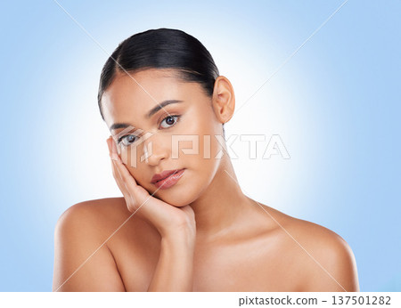 Beauty, makeup and skincare with portrait of woman in studio for cosmetics, glow and self care. Health, spa and dermatology with face of person on blue background for natural facial and salon Beauty, makeup and skincare with portrait of woman in studio for cosmetics, glow and self care. Health, spa and dermatology with face of person on blue background for natural facial and salon 137501282