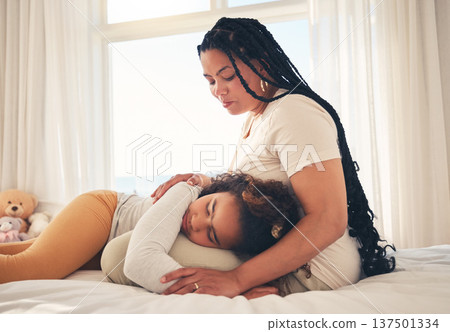 Family, mother and sad child for support lying on lap, relax and comfort in bedroom of house for depression. Love, woman and girl show care together, rest and bonding with peace on bed in apartment Family, mother and sad child for support lying on lap, relax and comfort in bedroom of house for depression. Love, woman and girl show care together, rest and bonding with peace on bed in apartment 137501334