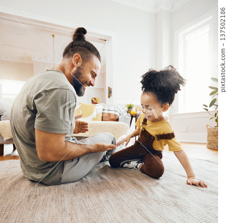 Happy family, father and child with hand game on floor of living room for learning, love and development. Smile, person and kid on ground in lounge of apartment for relax, happiness and care Happy family, father and child with hand game on floor of living room for learning, love and development. Smile, person and kid on ground in lounge of apartment for relax, happiness and care 137502186