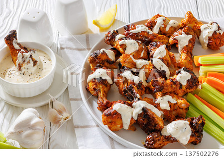 Alabama white sauce chicken wings with vegetables 137502276