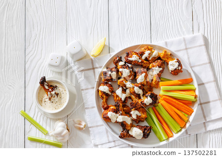 Alabama white sauce chicken wings with vegetables Alabama white sauce chicken wings with vegetables 137502281