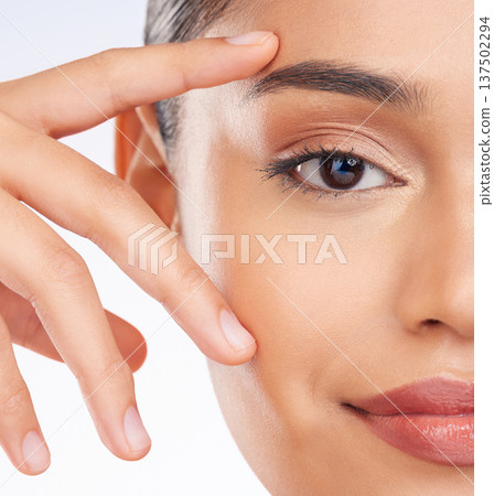 Half face, closeup and woman with skincare, beauty or dermatology on a studio background. Portrait, person or model with grooming routine, luxury or wellness with facial, shine or glow with cosmetics Half face, closeup and woman with skincare, beauty or dermatology on a studio background. Portrait, person or model with grooming routine, luxury or wellness with facial, shine or glow with cosmetics 137502294