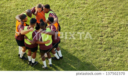 Soccer group, men and huddle for motivation, support and game strategy talk on sport field. Above, grass and exercise of a training team together with solidarity and friends outdoor for competition Soccer group, men and huddle for motivation, support and game strategy talk on sport field. Above, grass and exercise of a training team together with solidarity and friends outdoor for competition 137502370