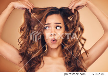 Surprise, woman and happy for curly hair beauty isolated on a brown background in studio. Wow, hairstyle and natural cosmetics of shocked model in salon treatment for health, wellness or hairdresser 137502389