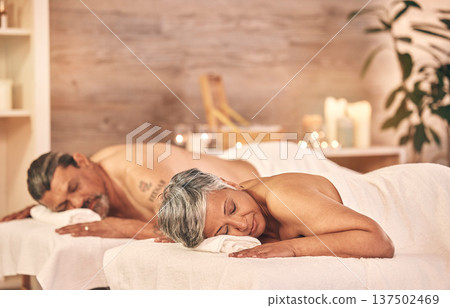 Wellness, massage and couple in spa to relax on holiday, vacation and anniversary celebration. Love, luxury resort and mature man and woman on bed in salon for beauty, therapy and skincare treatment Wellness, massage and couple in spa to relax on holiday, vacation and anniversary celebration. Love, luxury resort and mature man and woman on bed in salon for beauty, therapy and skincare treatment 137502469