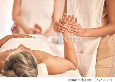 Spa, relax and a woman with a hand massage for wellness, salon treatment and grooming. Luxury, skincare and a person with a masseuse for a manicure, stress relief or beauty circulation at a hotel Spa, relax and a woman with a hand massage for wellness, salon treatment and grooming. Luxury, skincare and a person with a masseuse for a manicure, stress relief or beauty circulation at a hotel 137502774